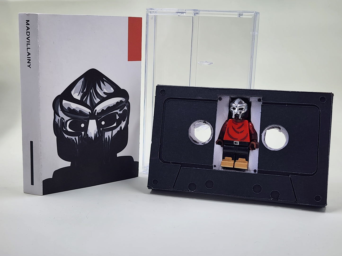 Metal Face Villain Minifigure With Cassette Display Case (MADVILLAINY)