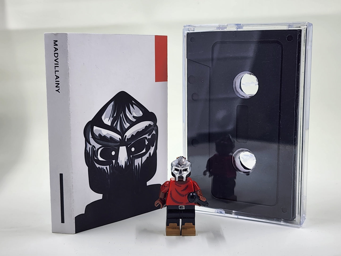 Metal Face Villain Minifigure With Cassette Display Case (MADVILLAINY)