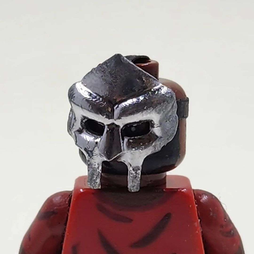 Metal Face Villain Minifigure With Cassette Display Case (MADVILLAINY)